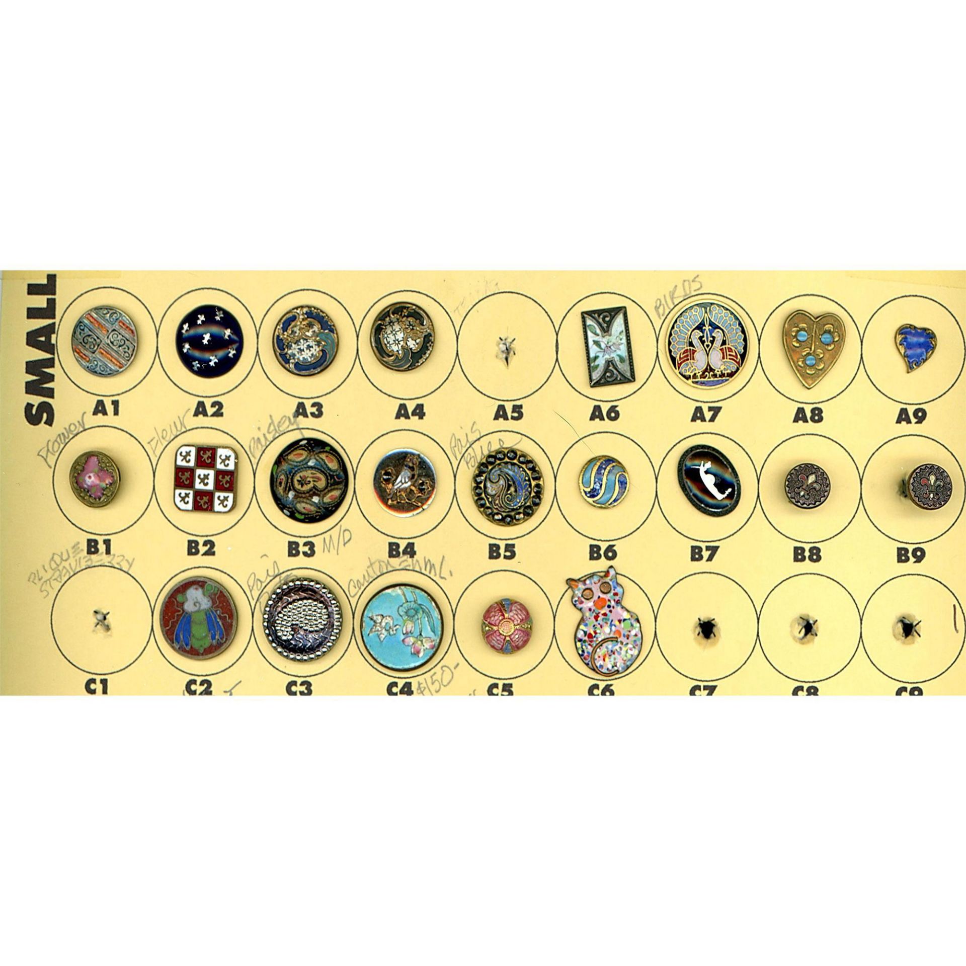 A partial card of division one and three enamel buttons