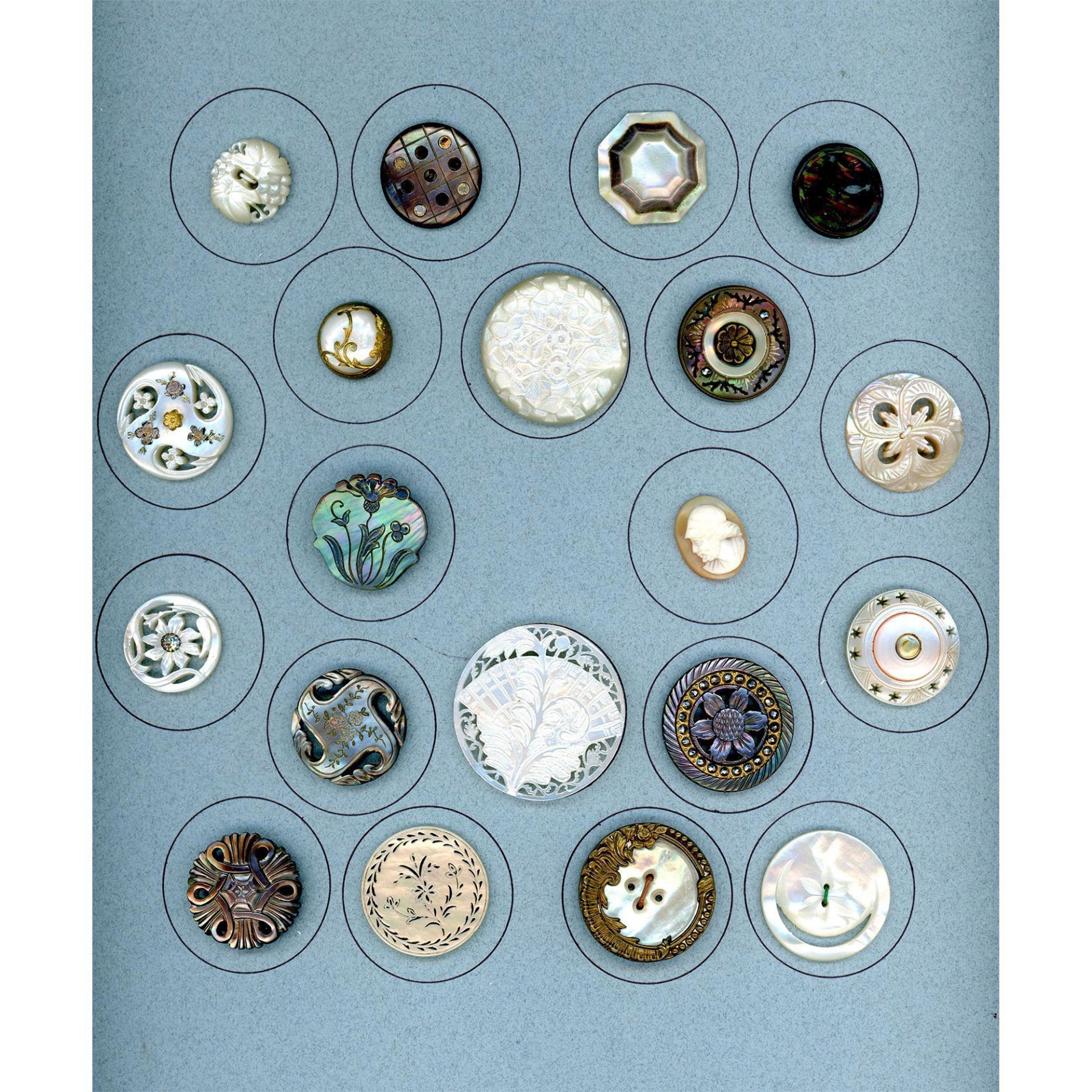 A card of division one and three pearl & shell buttons