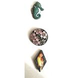 A small card of division three ceramic buttons