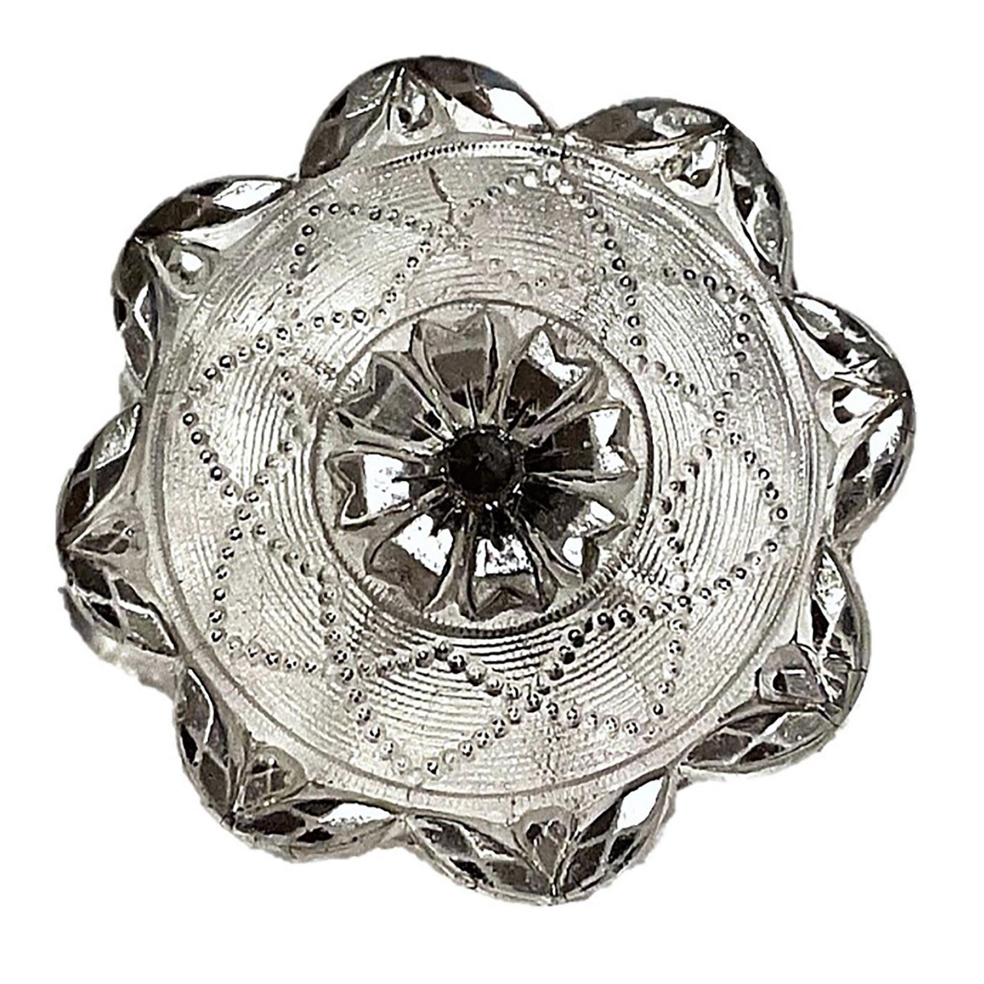 A division one silver lustered lacy glass button