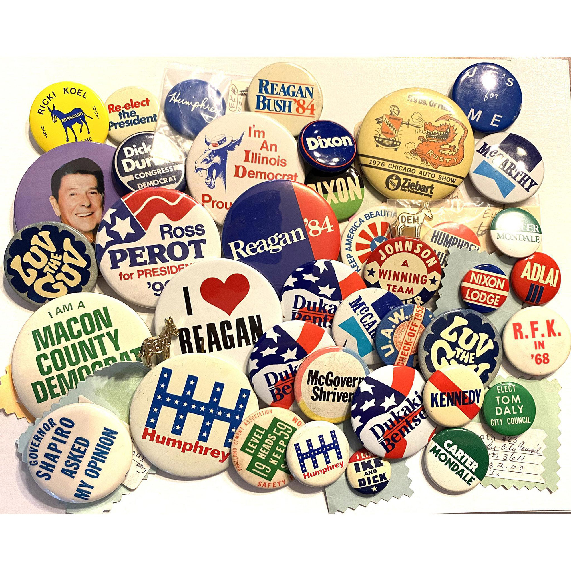 A bag lot of assorted political pin back buttons