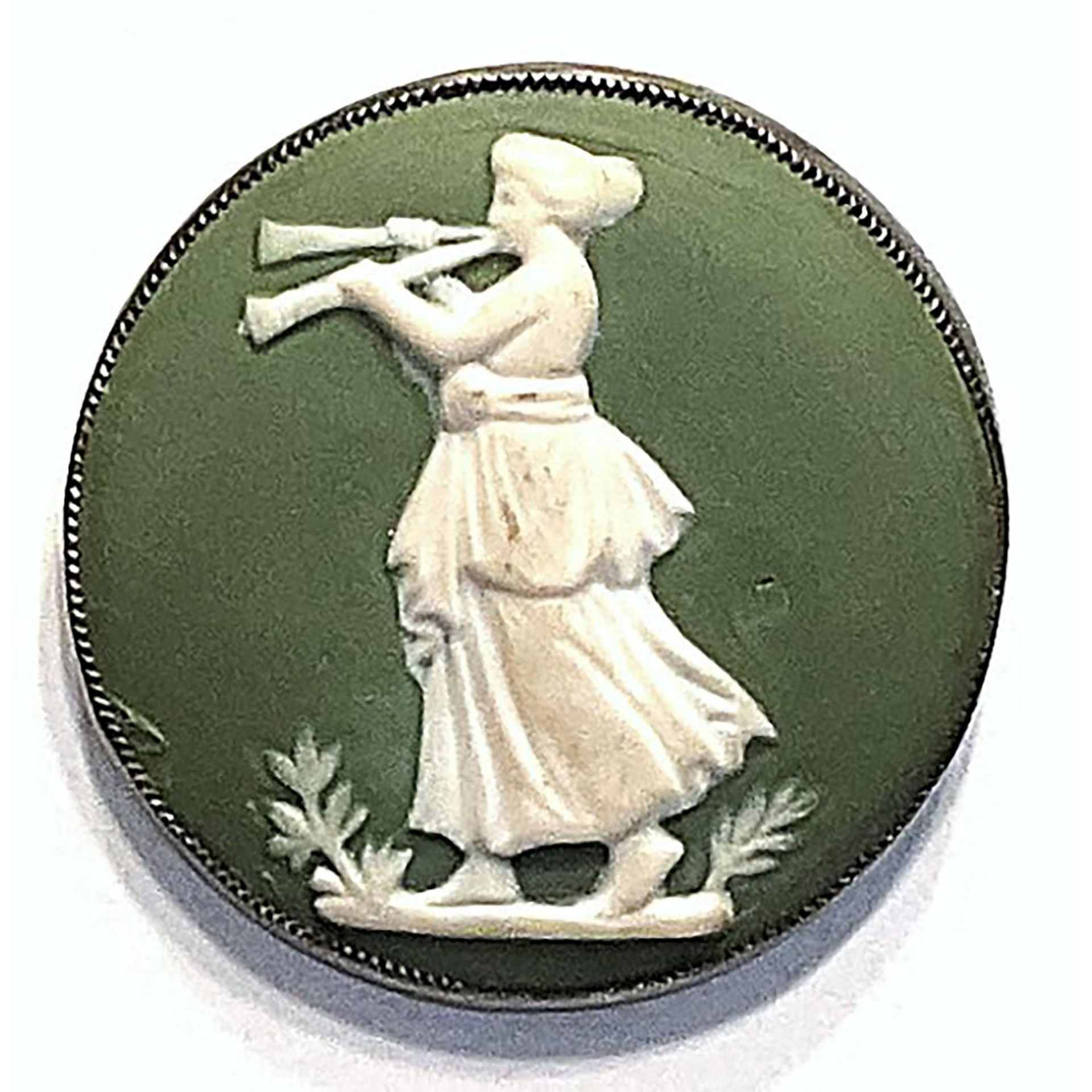 A division one figural women with an instrument button