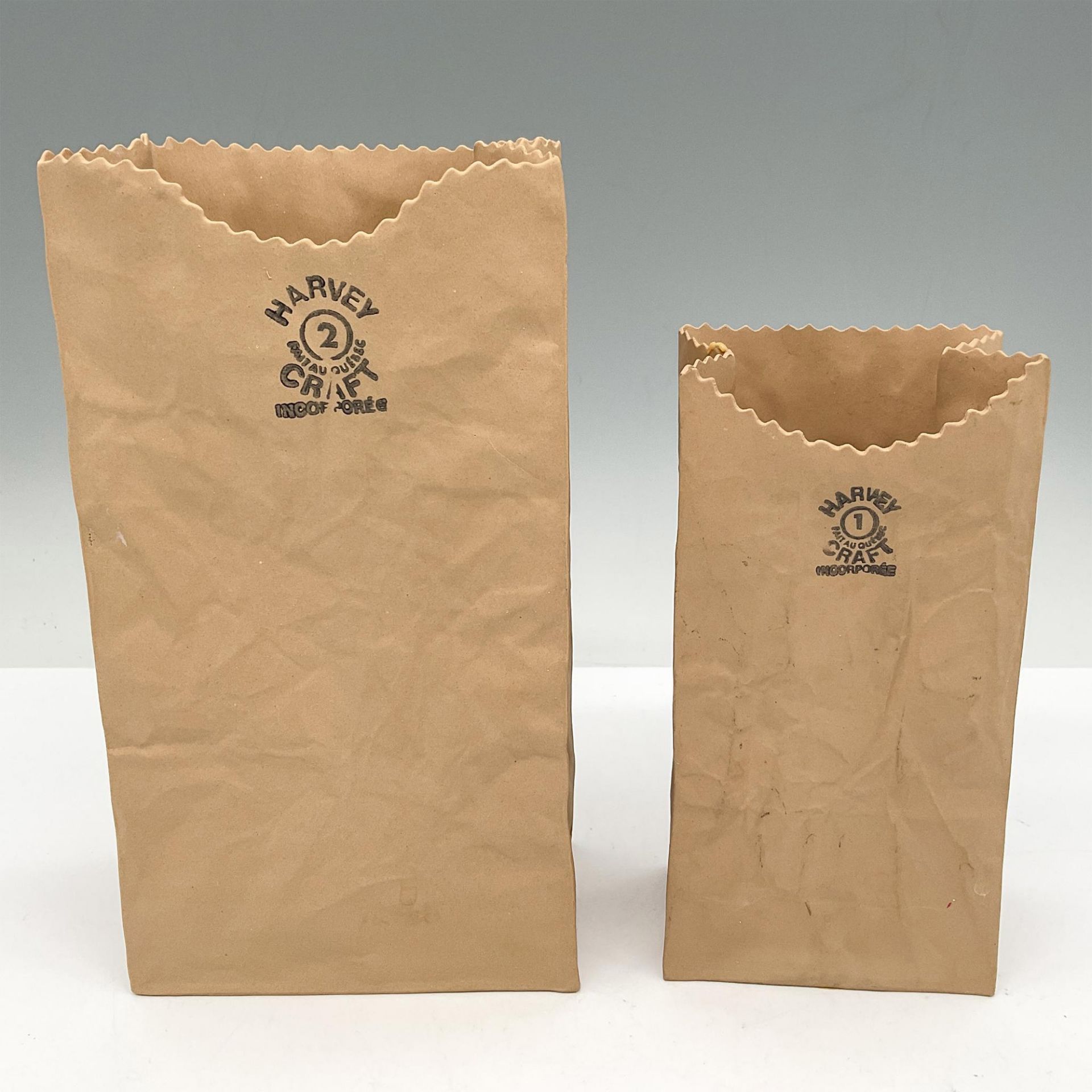 2pc Michel Harvey Ceramic Sculpture, Paper Bags