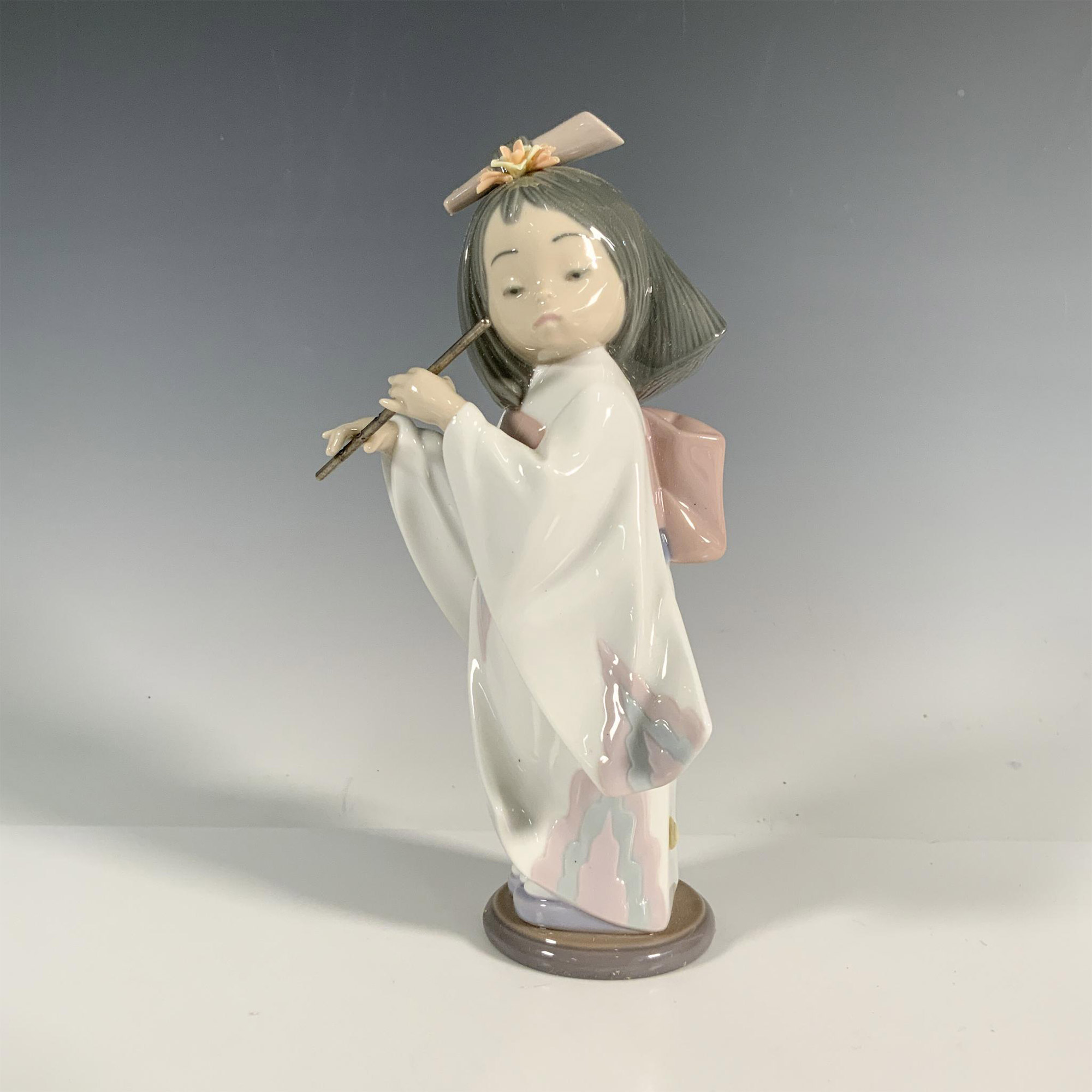 Playing The Flute 1006150 - Lladro Porcelain Figurine