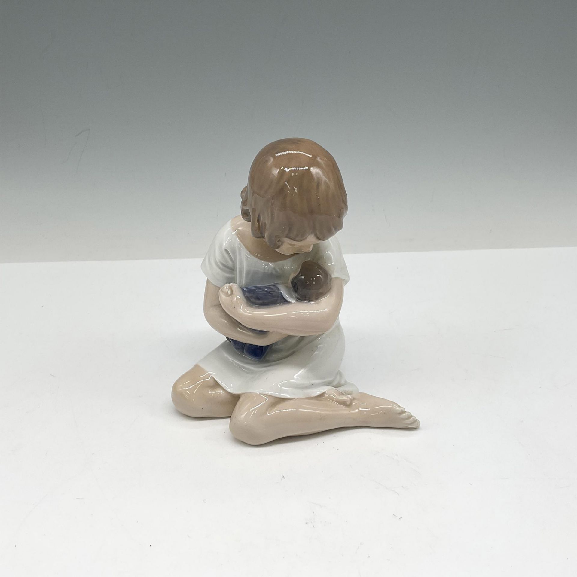 Royal Copenhagen Porcelain Figurine, Girl with Doll