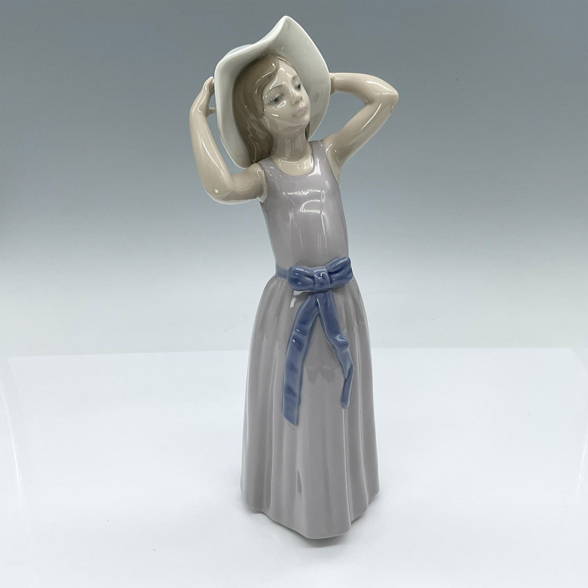 Lladro Porcelain Figurine, Coy Girl in Straw Hat 1005011