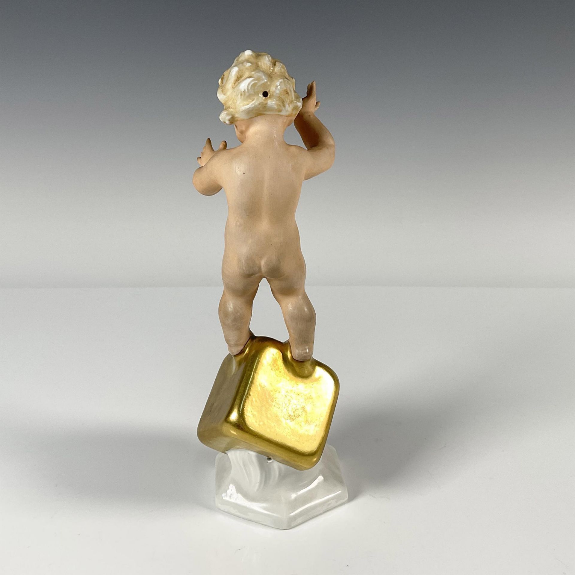 Carl Scheidig Porcelain Figurine, Cherub on Gold Cube - Image 2 of 3
