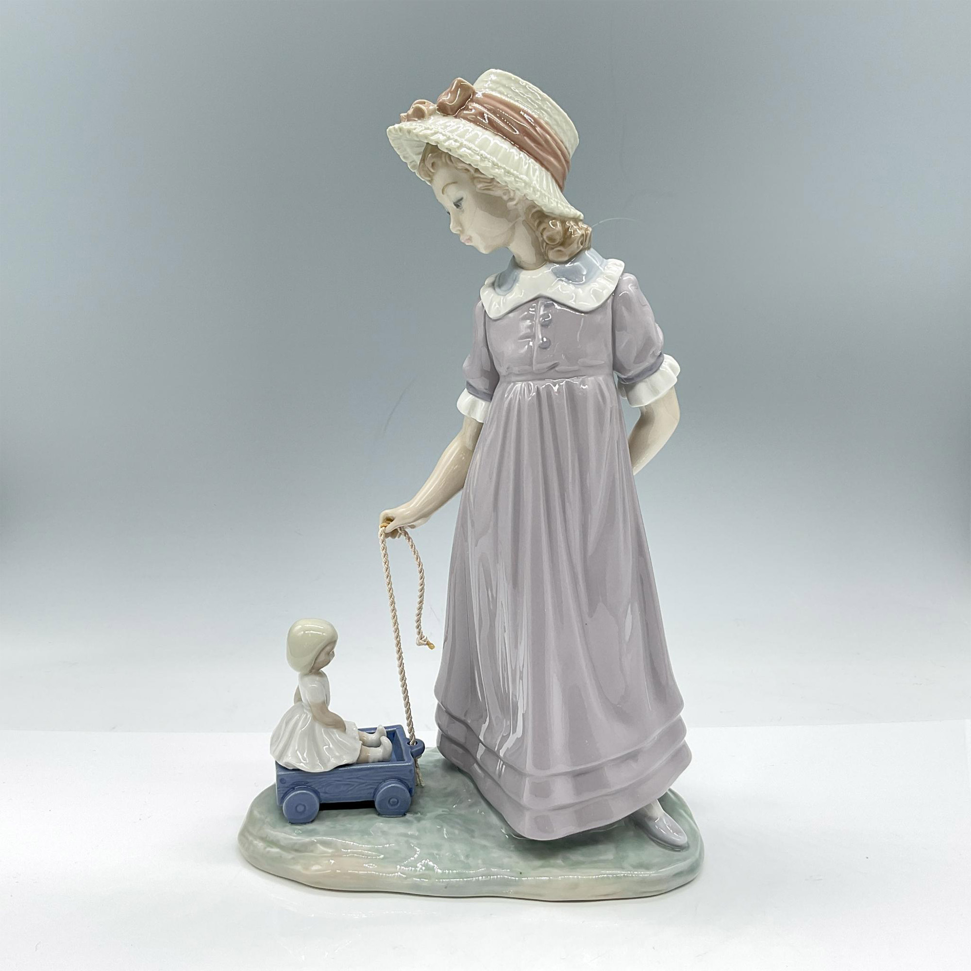 Girl with Toy Wagon 1005044 - Lladro Porcelain Figurine