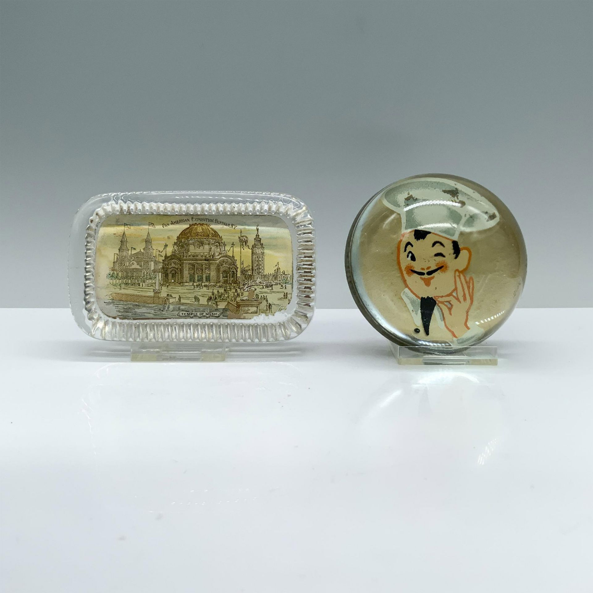 2pc 1901 American Exposition and Winking Chef Paperweight