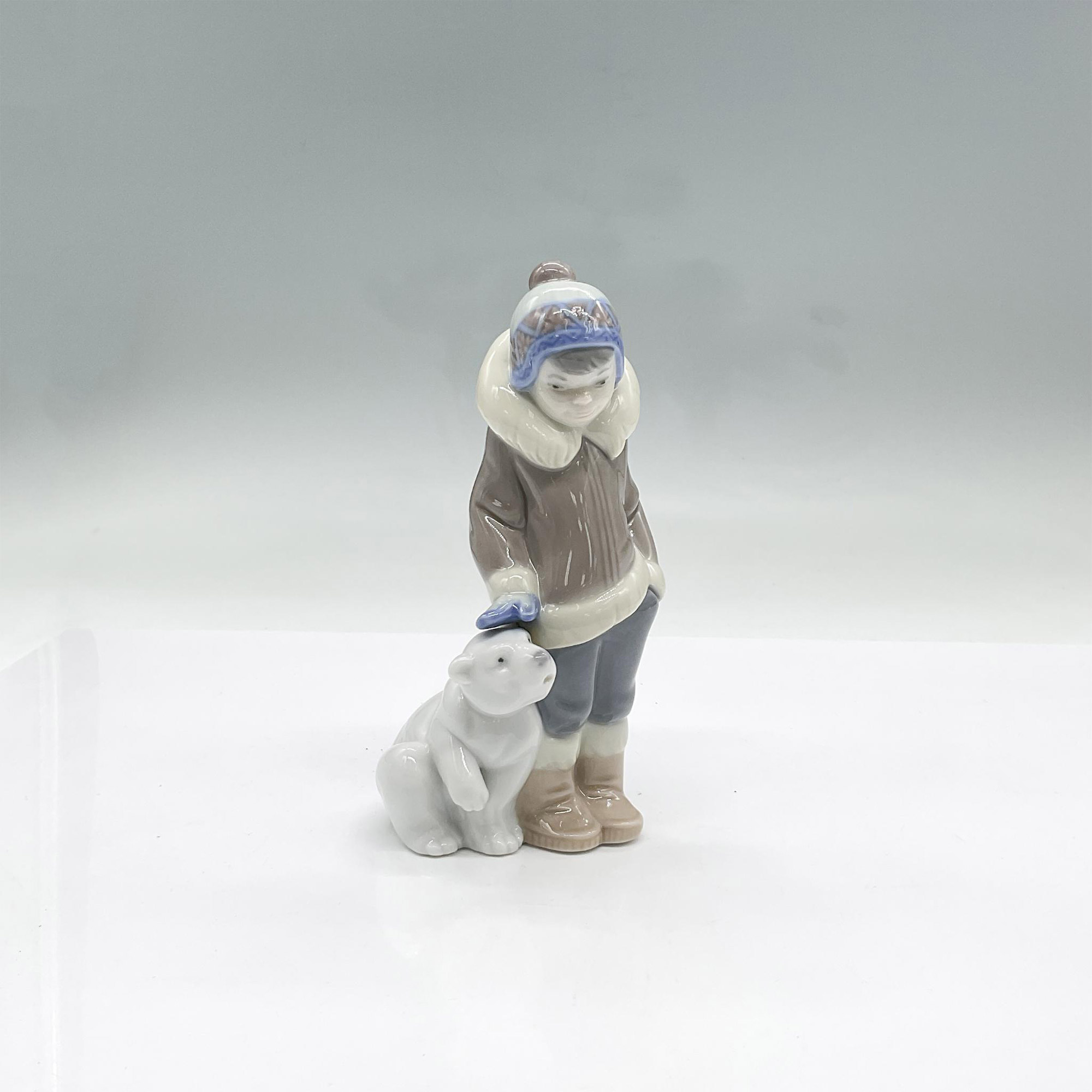 Eskimo Boy With Pet 1005238 - Lladro Porcelain Figurine