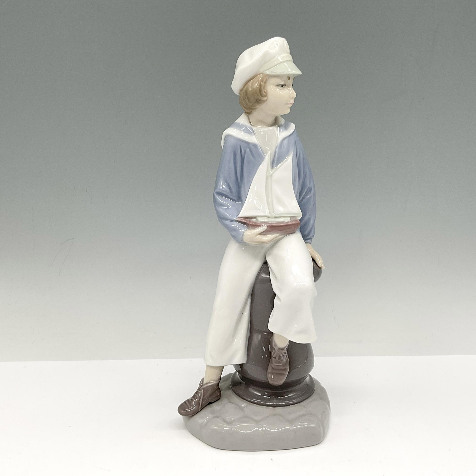 Boy with Yacht - Lladro Porcelain Figurine