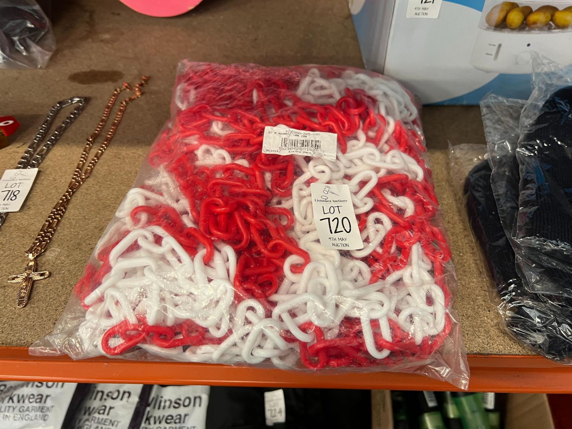 BAG OF NEW RED AND WHITE PLASTIC SAFETY CHAIN