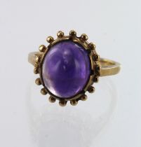 9ct yellow gold amethyst dress ring, one amethyst oval cabochon measures 11mm x 10mm, beaded semi-