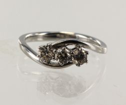 White gold (tests 9ct) diamond trilogy ring, three round brilliant cuts TDW approx. 0.45ct,