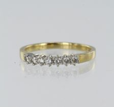 Yellow gold (tests 18ct) diamond half eternity ring, seven round brilliant cuts TDW approx. 0.