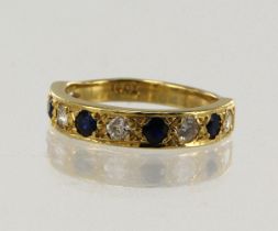 Yellow gold (tests 18ct) diamond and sapphire half eternity ring, five round brilliant cut diamonds