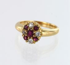Yellow gold (tests 18ct) antique diamond and ruby cluster ring, four diamonds TDW approx. 0.16ct,