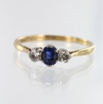 Yellow gold (tests 18ct) diamond and sapphire trilogy ring, one oval sapphire measuring 5mm x 4mm,