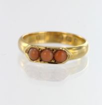 18ct yellow gold Victorian coral trilogy ring, three cabochon corals each measuring approx. 4mm,