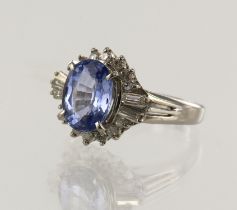 Platinum (tests 850) diamond and sapphire cluster ring, one oval sapphire approx. 1.95ct, surrounded