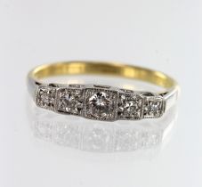 Yellow gold (tests 18ct) diamond five stone ring, one round brilliant cut approx. 0.14ct, flanked