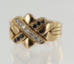 Yellow gold (tests 18ct) puzzle ring, four bands, two stone set bands, one set with diamonds TDW