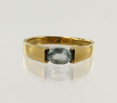 Yellow gold (tests 18ct) aquamarine ring, one oval aquamarine measuring 7mm x 5mm, finger size R/