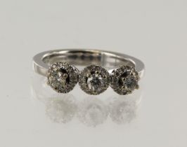 White gold (tests 18ct) diamond triple cluster ring, TDW approx. 0.30ct, finger size N/O, weight 6.