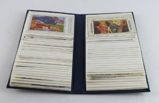 Comic, blue album containing original mixed collection   (approx 95 cards)