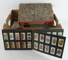 Crate with a quantity of sets, part sets & odds, contained in a box file, albums, tin, boxes,