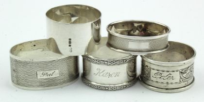 Five silver napkin rings all bear British hallmarks - various, (plus an empty cardboard box).