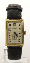 Gents 18ct cased Omega manual wind wristwatch, circa 1923. The silvered dial with Arabic numerals,