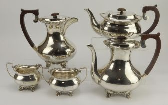 Five piece silver teaset with wooden handles and finials, comprising coffee pot, hot water jug,