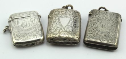 Three silver vesta cases, all have floriate engraving on them. Hallmarked for Birm 1895, 1901 and