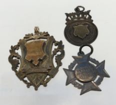 Three silver fob medals/ pendants, total weight 42g.