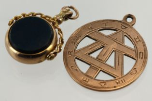 Two fob pendants to include one yellow gold (tests 9ct) swivel set with bloodstone and cornelian.