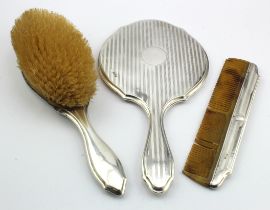 Chester, silver-backed three piece dressing-table set comprising hand mirror, hairbrush and comb