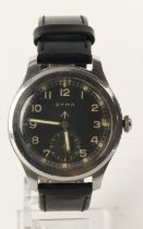 Cyma British military issue 'Dirty Dozen' wristwatch. The black dial with white Arabic numerals,