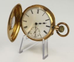 Gents '14k' tests 14ct cased half hunter stem-wind pocketwatch. The white enamel dial with Roman