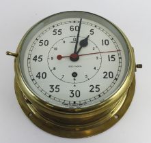 Brass bulkhead clock, with Arabic numerals to dial, working at time of cataloguing, dial diameter