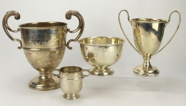 Silver. Four silver hallmarked trophies (one not engraved), tallest 26cm approx,, silver weight 51.