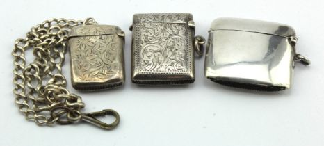 Three silver vesta cases, two have floriate engraving on them (one of which is a bit bashed) the