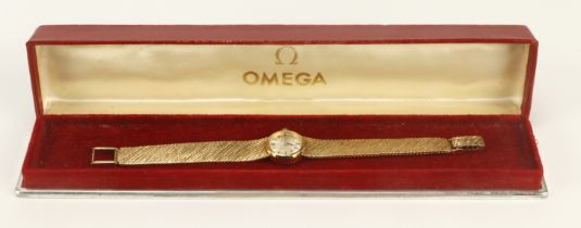 Ladies 9ct cased Omega manual wind wristwatch, 1966. The silvered dial with baton markers, Omega