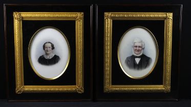 Pair of matching 19th century portraits on porcelain. Each within an oval frame, set in a glazed
