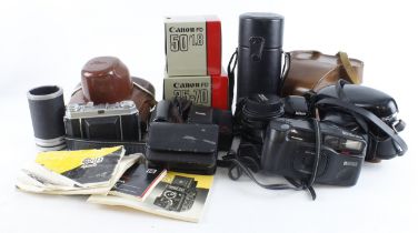Cameras & Lenses. A collection of various cameras and lenses, including Canon, Exakta, Agiflex,