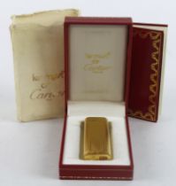 Cartier gold plated lighter, contained in a Cartier case (with booklet)