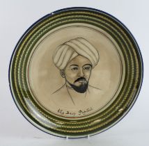 Middle Eastern hand painted glazed plate, depicting a male portrait, with the words 'Ady Hacp