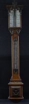 Mahogany ornately carved stick barometer, marked 'A. E. Coe Norwich', length 103cm approx. (buyer
