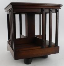 Mahogany revolving table top bookcase, height 34.5cm, diameter 43cm approx.