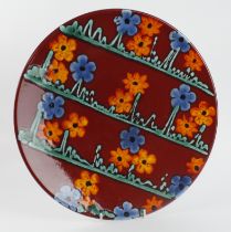 Poole Pottery limited edition charger, decorated with blue & orange flowers, makers stamp to